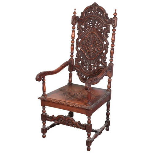 395 - AN OAK ARMCHAIR

in 17th century style, with foliate carved and pierced back over a square seat, on ... 