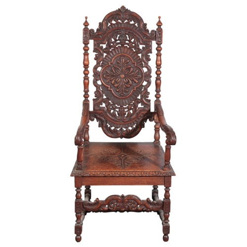 395 - AN OAK ARMCHAIR

in 17th century style, with foliate carved and pierced back over a square seat, on ... 