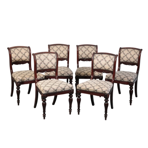 445 - A SET OF SIX EARLY VICTORIAN ROSEWOOD DINING CHAIRS

with scrolled cresting rails and carved splats,... 