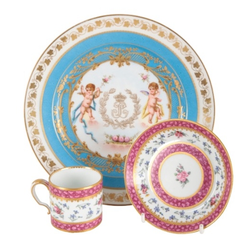 48 - A SÈVRES PORCELAIN COFFEE CAN AND SAUCER

18th century, enamelled with floral sprays within mottled ... 