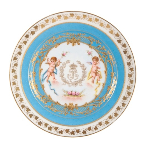 48 - A SÈVRES PORCELAIN COFFEE CAN AND SAUCER

18th century, enamelled with floral sprays within mottled ... 