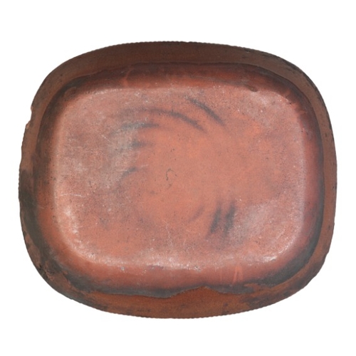 64 - AN ENGLISH TERRACOTTA SLIPWARE DISH

late 19th century, possibly Newcastle, 7.5cm high x 31cm wide

... 