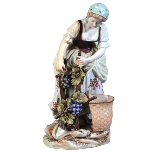 69 - A CONTINENTAL PORCELAIN FIGURE OF A GRAPE HARVESTER

19th century, bearing a Vienna style beehive ma... 