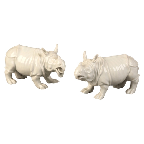 95 - A PAIR OF MEISSEN PORCELAIN RHINOCEROS

19th century, bearing blue crossed swords marks to the bases... 