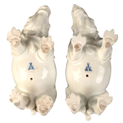 95 - A PAIR OF MEISSEN PORCELAIN RHINOCEROS

19th century, bearing blue crossed swords marks to the bases... 