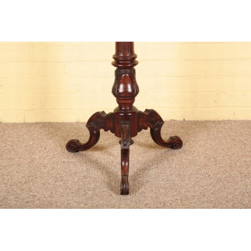 101 - A LATE VICTORIAN MAHOGANY TORCHERE

the circular top inset with a baize lining, on a fluted columnar... 