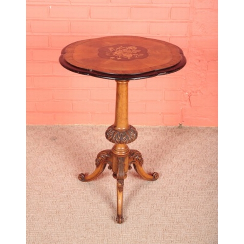 124 - A VICTORIAN WALNUT AND MARQUETRY TRIPOD TABLE

the shaped top inlaid with a central floral spray, on... 