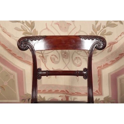 126 - A SET OF SIX WILLIAM IV MAHOGANY DINING CHAIRS IN THE MANNER OF GILLOWS

with carved and shaped back... 