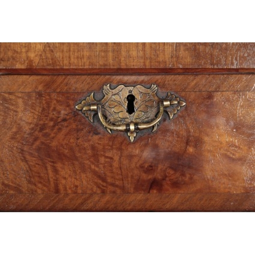 136 - A GEORGE I STYLE WALNUT AND CROSSBANDED CHEST ON CHEST

the upper section with a moulded cornice ove... 