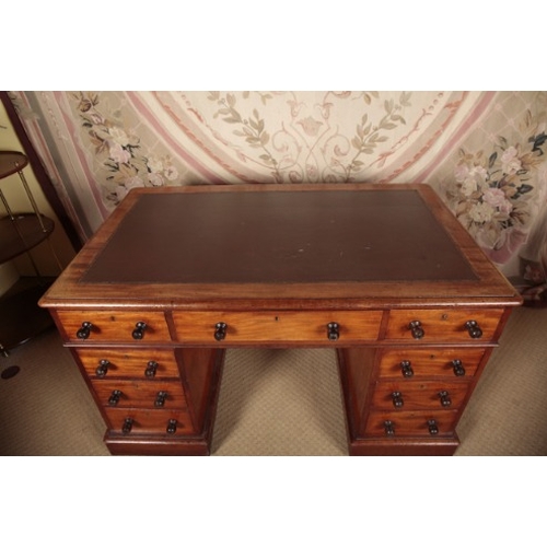 143 - A VICTORIAN MAHOGANY PEDESTAL DESK

the top inset with a gilt tooled leather writing surface, over a... 