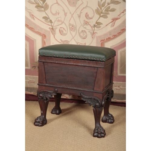 144 - AN EDWARDIAN MAHOGANY PIANO STOOL

the leather covered hinged lid opening to a vacant interior, on h... 