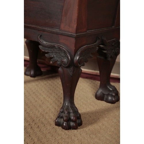 144 - AN EDWARDIAN MAHOGANY PIANO STOOL

the leather covered hinged lid opening to a vacant interior, on h... 