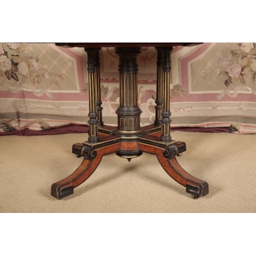 147 - A VICTORIAN AMBOYNA, EBONISED AND GILT METAL MOUNTED CENTRE TABLE STAMPED GILLOWS

the oval top with... 