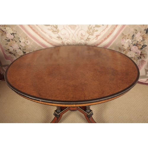 147 - A VICTORIAN AMBOYNA, EBONISED AND GILT METAL MOUNTED CENTRE TABLE STAMPED GILLOWS

the oval top with... 