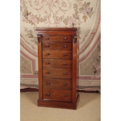 153 - A VICTORIAN WALNUT WELLINGTON CHEST

with seven short graduated drawers, 110cm high x 55cm wide x 38... 