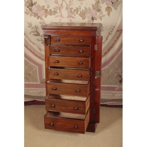 153 - A VICTORIAN WALNUT WELLINGTON CHEST

with seven short graduated drawers, 110cm high x 55cm wide x 38... 