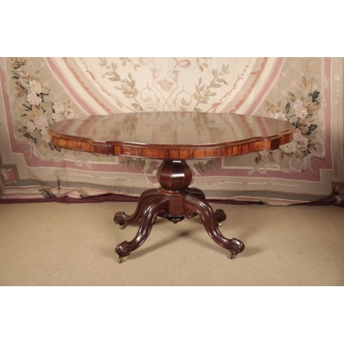 163 - A VICTORIAN ROSEWOOD CENTRE TABLE

the shaped tilt-top on a faceted baluster stem, to a quadruped ba... 