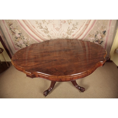 163 - A VICTORIAN ROSEWOOD CENTRE TABLE

the shaped tilt-top on a faceted baluster stem, to a quadruped ba... 