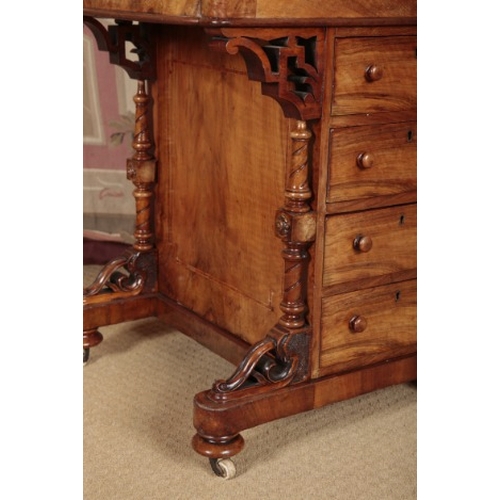 166 - A VICTORIAN WALNUT DAVENPORT

the gilt tooled leather writing slope opening to a vacant interior, th... 