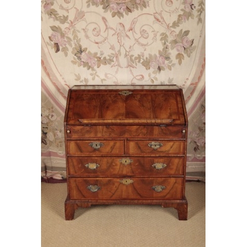 168 - A QUEEN ANNE WALNUT BUREAU

early 18th century and later, the herringbone crossbanded fall front ope... 