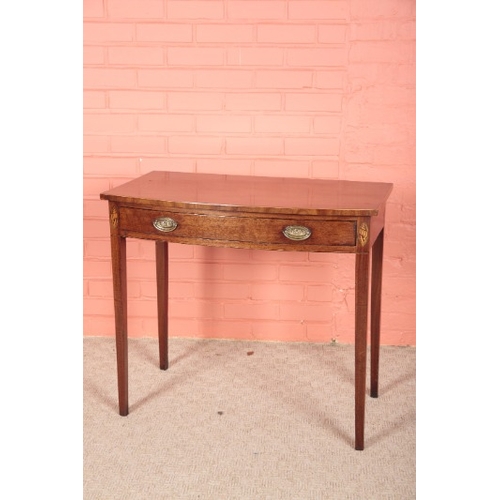 186 - A GEORGE III MAHOGANY BOW FRONT SIDE TABLE

with a single frieze drawer, inlaid with shell motifs to... 