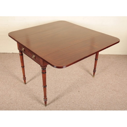 200 - A REGENCY MAHOGANY PEMBROKE TABLE

with a single frieze drawer on ring-turned and tapered legs termi... 