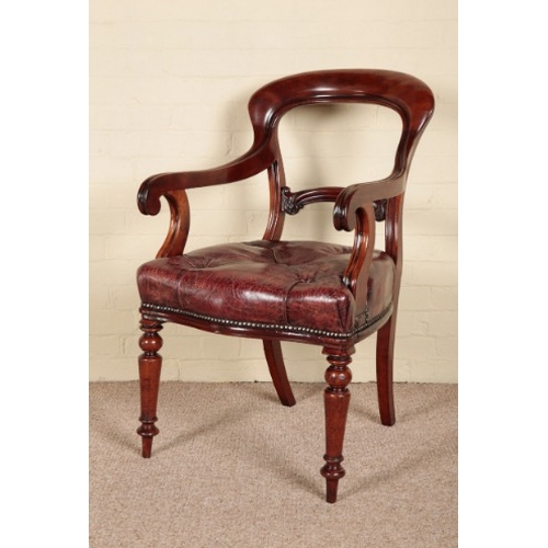 201 - AN EARLY VICTORIAN MAHOGANY DESK CHAIR

the shaped and carved back over a leather covered buttoned s... 