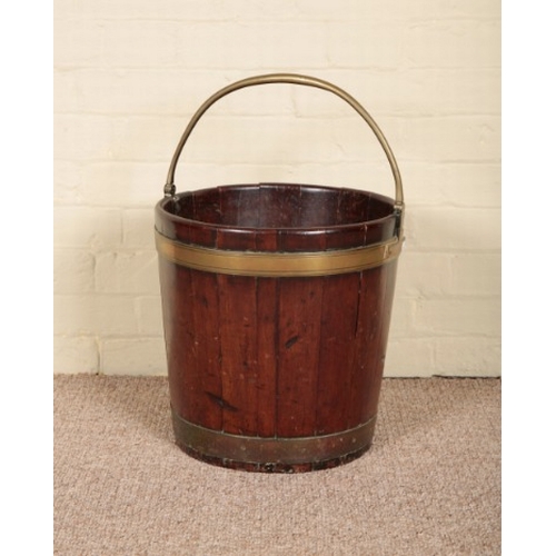 203 - A MAHOGANY AND BRASS BOUND PEAT BUCKET

late 18th/early 19th century, the coopered body with hinged ... 