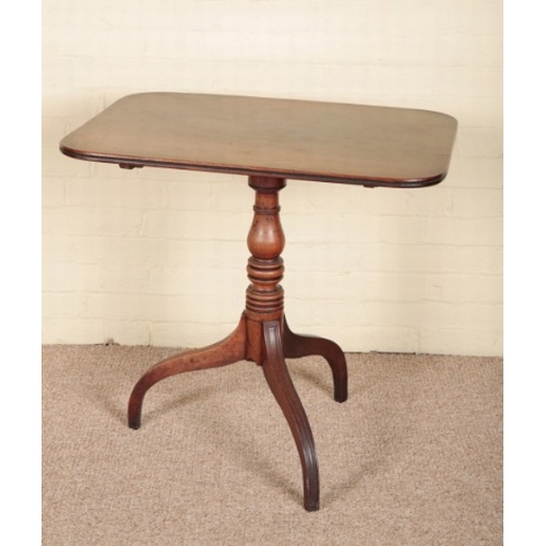 205 - A REGENCY MAHOGANY TRIPOD TABLE

the rectangular tilt-top on a ring turned stem to moulded legs, 71c... 