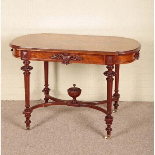 207 - A VICTORIAN WALNUT CENTRE TABLE

the quarter veneered and shaped top over a frieze centred by carved... 