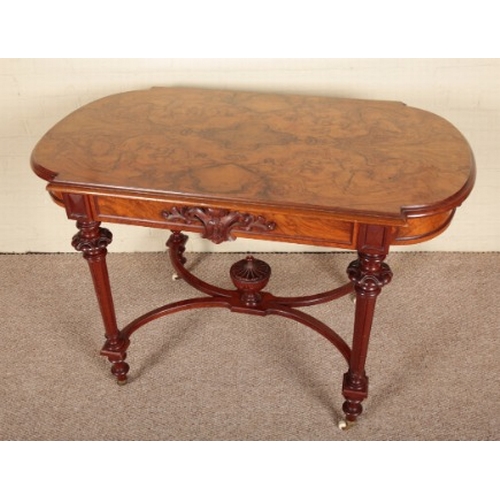 207 - A VICTORIAN WALNUT CENTRE TABLE

the quarter veneered and shaped top over a frieze centred by carved... 