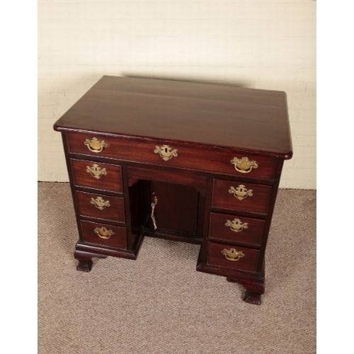 209 - A GEORGE II MAHOGANY KNEEHOLE DESK

circa 1750, the one long and six short drawers around a central ... 