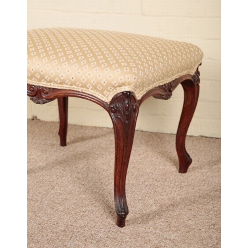 214 - A VICTORIAN ROSEWOOD STOOL

stamped 'C. Munro', the covered square seat on slender carved cabriole l... 