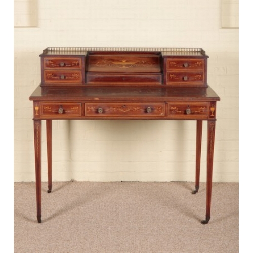 218 - A MAHOGANY AND MARQUETRY DESK BY EDWARDS AND ROBERTS

stamped to the drawer lining, the raised super... 