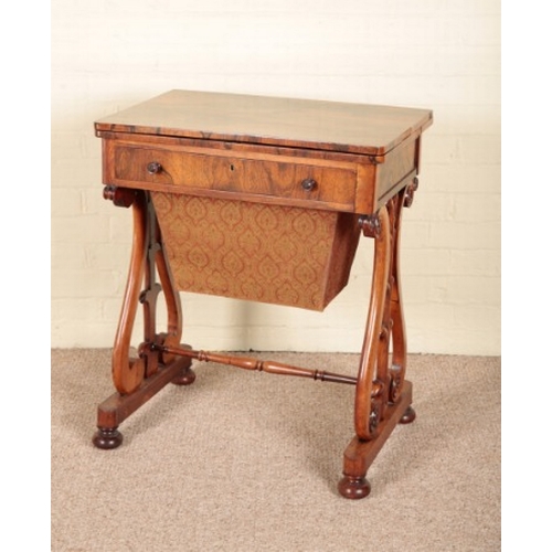 235 - A VICTORIAN ROSEWOOD WORK TABLE

the hinged lid opening to a gilt tooled leather writing surface, a ... 