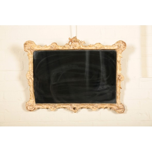 246 - A LATE VICTORIAN GILTWOOD AND COMPOSITION MIRROR

the rectangular plate within a scrolled and shell ... 