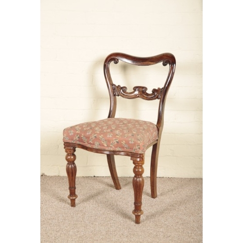 256 - A SET OF FOUR VICTORIAN ROSEWOOD DINING CHAIRS

the shaped and pierced back splats over covered serp... 