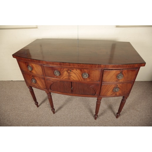 258 - A REGENCY BOWFRONT SIDEBOARD

with an arrangement of short drawers, tambour fronted cupboard and lea... 