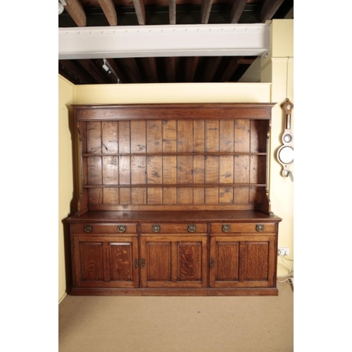 260 - A LARGE OAK DRESSER

early 20th century, the upper section with a moulded cornice over shelves with ... 