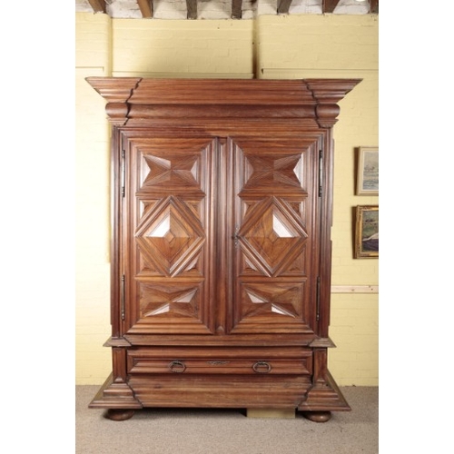 271 - AN IMPRESSIVE FRENCH ARMOIRE

17th century, probably Burgandy, the inverted breakfront pediment over... 