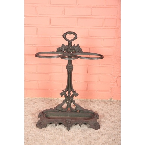 273 - A VICTORIAN CAST IRON STICK STAND

with a lifting drip tray to the base, 72cm high x 50cm wide