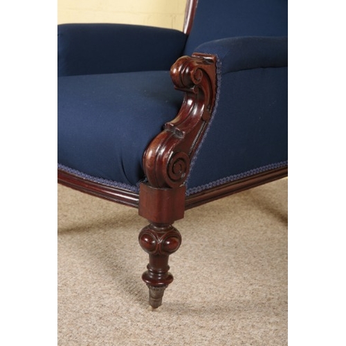 296 - A VICTORIAN MAHOGANY ARMCHAIR

with dark blue covers, the square back over scrolled arms and bowfron... 