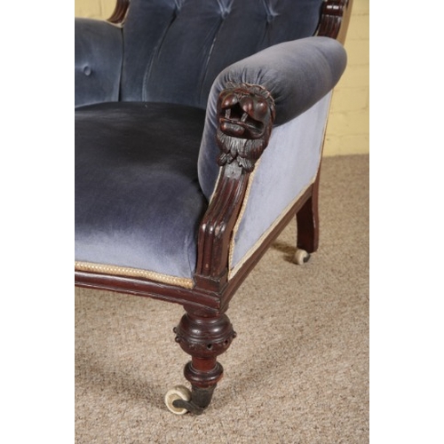 314 - A VICTORIAN MAHOGANY ARMCHAIR

with button back velvet covers, the arms with lions' head terminals, ... 