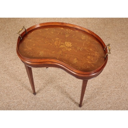 315 - A WALNUT AND MARQUETRY TRAY TOP COFFEE TABLE

the kidney-shape lifting top with brass handles, the s... 