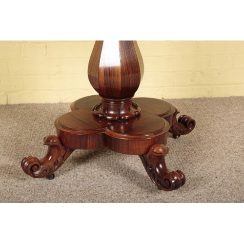 364 - A WILLIAM IV ROSEWOOD CARD TABLE

the hinged lid opening to a blue baize-lined interior, on a facete... 