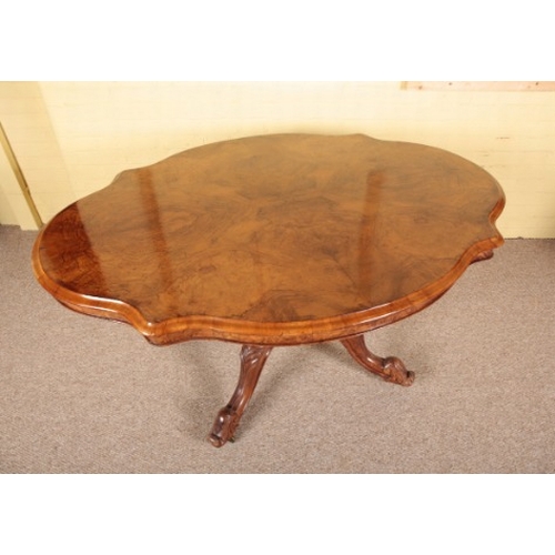 386 - A VICTORIAN WALNUT CENTRE TABLE

the shaped tilt-top on a turned stem to quadruped base, with cabrio... 