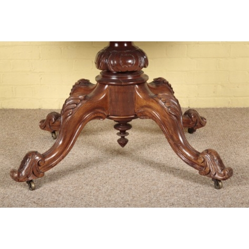 386 - A VICTORIAN WALNUT CENTRE TABLE

the shaped tilt-top on a turned stem to quadruped base, with cabrio... 