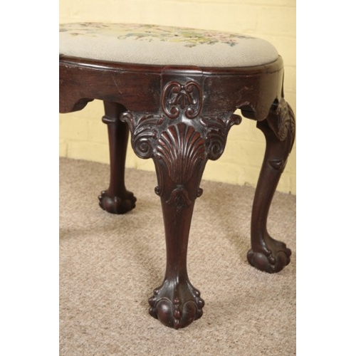 393 - A GEORGE II STYLE MAHOGANY STOOL

19h century, with needlework drop-in seat, on shell carved cabriol... 