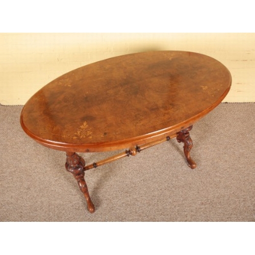 408 - A VICTORIAN WALNUT AND MARQUETRY OCCASIONAL TABLE

the oval top on turned supports joined by a stret... 