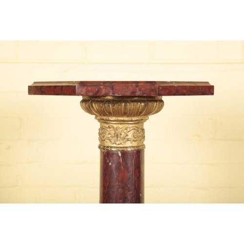 448 - A ROUGE MARBLE AND GILT METAL MOUNTED TORCHERE

the octagonal top on a columnar stem to a stepped pl... 